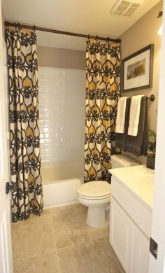 What a great idea.....I've been looking for one for ever and now I shall check the window curtains lol   Bathroom…Use regular curtains and take rod to the ceiling – so easy with huge impact! @ DIY House Remodel
