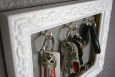 Key holder. Diy. An old picture frame and a few small cup hooks can be turned into a great place to keep your keys organized. Just remove the glass from the frame and insert the hooks to hang your keys. - 150 Dollar Store Organizing Ideas and Projects for the Entire Home
