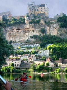 
                    
                        View of Chateau de Beynac from Canoe on Dordogne River , France.
                    
                