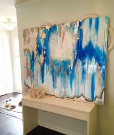 
                    
                        Blue and silver Ikat Painting with gold leaf. White entryway with chandelier.
                    
                