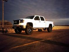 
                    
                        Lifted white GMC Truck
                    
                