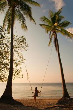 swing | palm trees | beach holiday | island life | solitude | serene | calm | peaceful | freedom | girl on a swing | silhouette | sunset | www.republicofyou.com.au