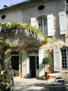 FleaingFrance Brocante Society in Provence. White shutters and beautiful greenery.