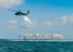 
                    
                        An MH-60S Sea Hawk helicopter provides search and rescue support near the Military Sealift Command hospital ship USNS Comfort (T-AH 20).
                    
                