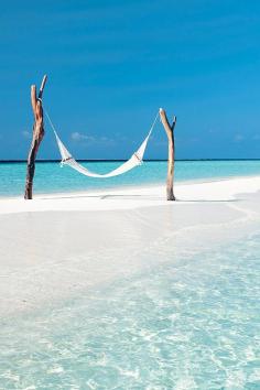 
                    
                        Hammock at tropical turquoise beach | Constance Moofushi Resort, Maldives
                    
                