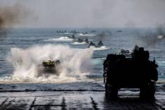 
                    
                        USMC amphibious assault vehicles assigned to the 31st Marine Expeditionary Unit (31st MEU) launch from the well deck of the Whidbey-Island-class amphibious assault ship USS Ashland (LSD 48).
                    
                