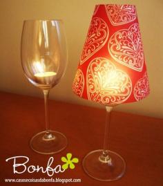 Cheap wine glass + tea light candle + paper cup with bottom cut out - nice way to dress up a dinner table