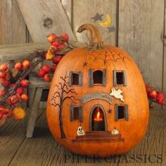 
                    
                        Our Ghoulish Greetings - Lit House Pumpkin is perfect for Halloween and comes with an electric candle & bulb to illuminate the carvings on pumpkin. Includes flicker bulb (5-watt max.) and 6 foot cord. Size: 12" High x 9 3/4" Diameter. Resin, Made in America.
                    
                