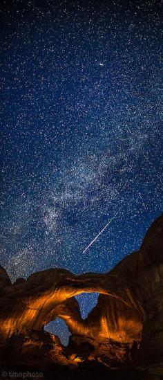 Perseid meteor streaking over the Double Arch in Arches National Park, Utah; photo by Thomas O'Brien
