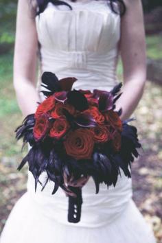 Love the black feathers in the bouquet! Maybe with white callas or fall colored flowers? Would be fun on table flower arrangements too!