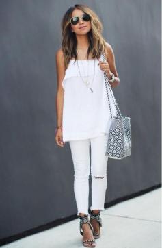 
                    
                        Sincerely Jules takes advantage of her pristine white jeans to create a crisp monochromatic look. #Fashion #SpringStyle
                    
                