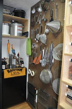 Ahhhh....Love the corkboard kitchen gadget organization!