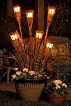 Great way to add more light to my outdoor room - solar tiki torches