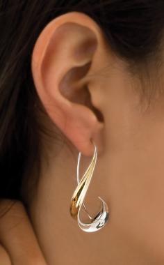 
                    
                        "Long Hook Earrings"  Silver & Gold Earrings    Created by Nancy Linkin   Sophisticated curves forged from sterling silver and 18K gold bimetal using the anticlastic technique.
                    
                