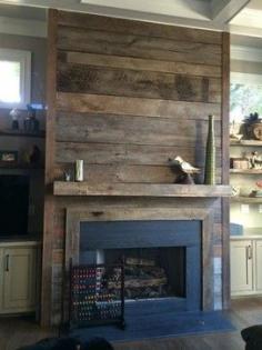 
                    
                        Reclaimed wood fireplace... it would be easy to cover the ugly brick with this and cheap but beautiful!!
                    
                