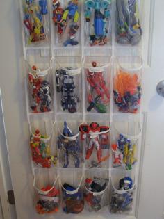 Use an over-the-door shoe organizer for toys...It may not look designer but in a kids room this is a perfect idea! 