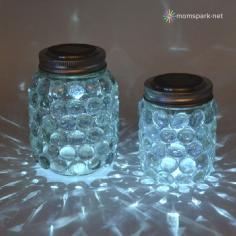 Solar Mason Jars. These DIY solar mason jar luminaries will do just the trick. Steps to Building Mason Jar Lights 1. Buy solar mason jars. 2. Glue beautiful glass beads or anything sparkly and see through. 3. Voila! Enjoy outdoor lighting. Photo Credit: : www.dreamalittlebigger.com/  #solarmasonjars #diybackyardlighting #backyardlighting