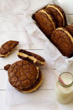 
                    
                        Brownie Cookie Sandwich with Peanut butter Frosting - fudgy, moist cookies that taste just like brownies filled with a fluffy peanut butter frosting.
                    
                