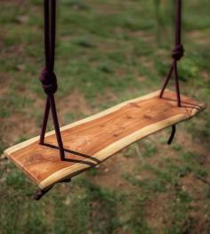 
                    
                        Take a seat on this cedar wood slab swing. With a sculpted, live edge and organic shape, the wood swing looks like a part of the tree it’ll hang on. Find the perfect branch, wait for a cool breeze and get swinging.
                    
                