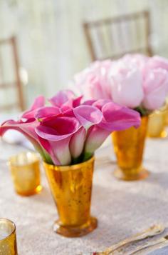 
                    
                        Vibrant pink calla lilies placed in a gold vase make for eye-catching centerpieces. Wedding Colors, Pink Flowers, Wedding Flowers, Centerpieces
                    
                