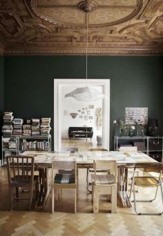 Bold green walls and personal treasures. | Dining room.