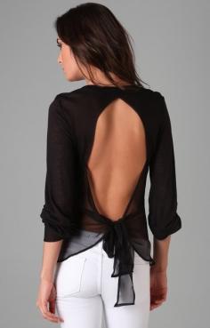 Love the open back shirt with white jeans