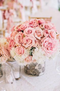 
                    
                        An arrangement of pink roses and white hydrangeas is simplistic elegance at its best. #weddingcenterpiece
                    
                
