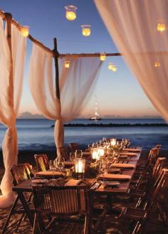 
                    
                        Hurricane lanterns and pillar candles will cast your décor in a mesmerizing glow. Destination Weddings, Beach Wedding Ideas
                    
                
