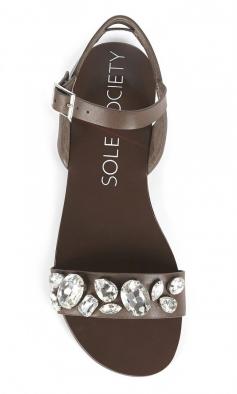 
                    
                        Brown leather slingback sandals bejeweled with rhinestones along the front and an adjustable ankle strap. ==
                    
                