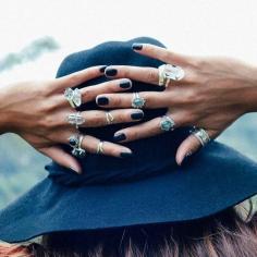 
                    
                        Black nails, rings aplenty and a great hat. Love!
                    
                