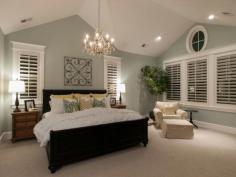 Love this master bedroom! Wall color, plantation shutters, vaulted ceilings!