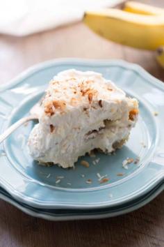 
                    
                        Coconut Banana Cream Pie | lemonsforlulu.com | Thick coconut infused custard layered between roasted bananas and resting in a graham cracker crust!
                    
                