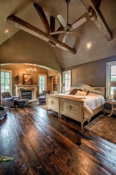 Dream master bedroom. Exposed beams, fire place, tons of floor space.