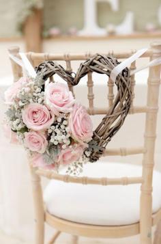 
                    
                        It really is the little things that count! These soft blush roses, accented with baby’s breath, make this chair back truly unique.
                    
                
