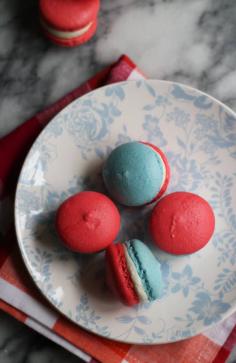 
                    
                        Macarons get PATRIOTIC! Red and blue shells sandwich vanilla buttercream in these red, white, and blue macarons.
                    
                