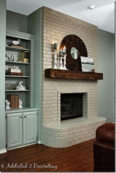 Painted fireplace screen with reclaimed wood mantel