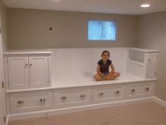 Custom Made Large Storage Bench - Bed. What an awesome idea in a little room! Stick a mattress in between and you've saved a whoooooole bunch of wasted space. *put some pillows on that top shelf, and you've got a reading nook too! the possibilities are endless!!