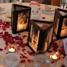 
                    
                        Picture frames glued together with no back and a flameless candle behind...illuminates the photos.
                    
                