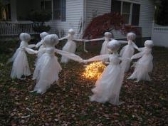 Just get yourself some:  Cheap Plastic Drop Cloths; White paper, newspaper or even leaves to stuff the heads; 6 or 8 Lengths of rebar- 3 to 4 feet high; Clear packing tape; a bunch of older outdoor white  Christmas Lights with a long extension cord #Halloween #decoration