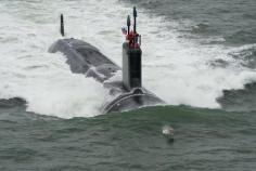 
                    
                        GREAT MILITARY SHOT OF SUBMARINE HEADING OUT TO SEA LED BY A PORPOISE!
                    
                