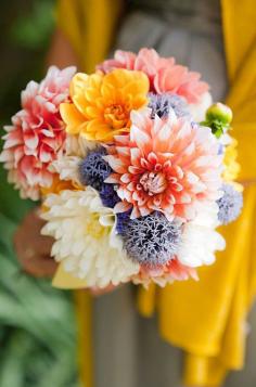 
                    
                        A bouquet of dahlias, in shades of orange and yellow, is reminiscent of a dazzling sunset.
                    
                