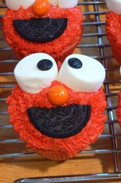 Ok ... Making these for my Babies 2nd Birthday Party in September! I will make him a BIG cake like this too... with baby elmo's and cookie monsters as cupcakes... super cute.