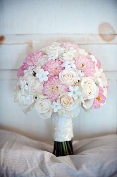 
                    
                        Pink dahlias make a stunning statement against blush roses and white stephanotis accented with crystal throat pins. Bridal Bouquets, Wedding Flowers, Floral Design
                    
                