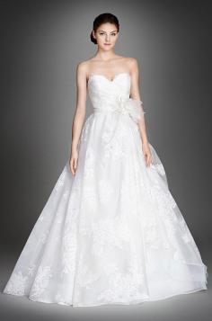 
                    
                        Ivory floral printed silk organza bridal ball gown, strapless sweetheart neckline. Lazaro, Fall 2015
                    
                