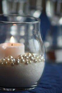 Sand (or sugar), faux pearls, a 3 candle. An easy DIY wedding centerpiece idea. Cute maybe?? Addition to center pieces