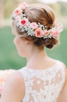 
                    
                        A pink floral crowns with soft baby’s breath is incredibly romantic. #weddingflowers
                    
                
