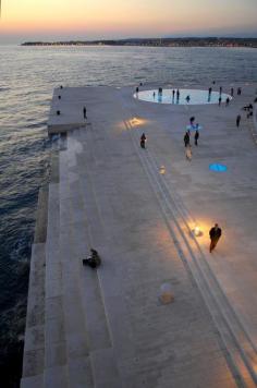 "Morske Orgulje" and or "The Sea Organ" Nikola Basic. Located on the shores of Zadar, Croatia, is the world’s first pipe organ which plays music by way of sea waves and 35 musically tuned polyethylene tubes located underneath a set of large marble steps--->2005