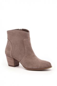 
                    
                        Taupe suede ankle bootie with a Western-inspired design and comfortable stacked heel ==
                    
                
