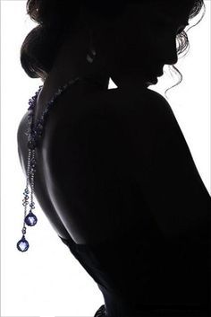 
                    
                        Black and white silhouette photo of beautiful woman with necklace, perfect for a boudoir pose!
                    
                