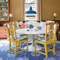 
                    
                        The unusual color palette gives the dining room a playful flair.
                    
                